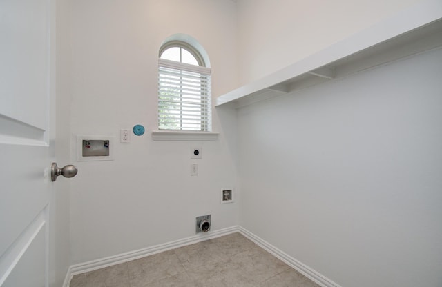 laundry area with gas dryer hookup, washer hookup, laundry area, electric dryer hookup, and baseboards