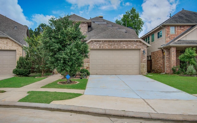 3730 Bach St, Iowa Colony, TX 77583 - traditional-style home featuring brick siding, concrete driveway, roof with shingles, a garage, and a front lawn