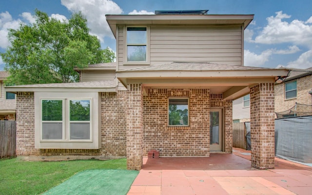 3730 Bach St, Iowa Colony, TX 77583 - back of property with a patio and brick siding
