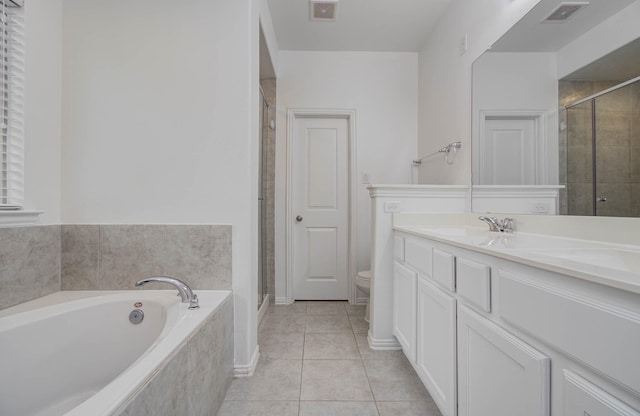3730 Bach St, Iowa Colony, TX 77583 - full bathroom with vanity, a bath, a shower stall, and tile patterned flooring