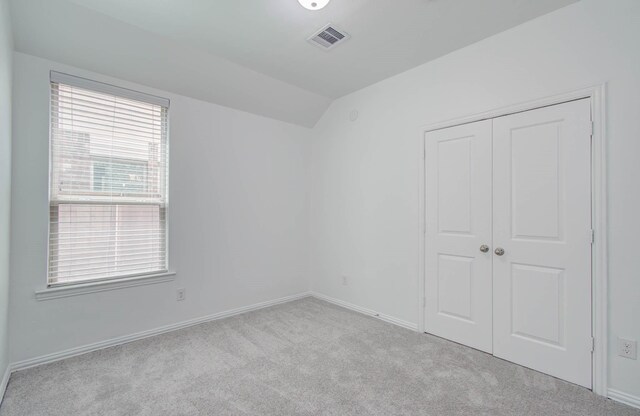 3730 Bach St, Iowa Colony, TX 77583 - unfurnished bedroom featuring carpet floors, lofted ceiling, and a closet