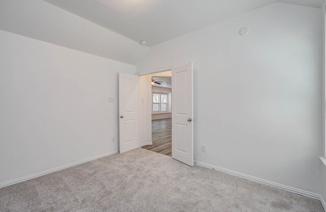3730 Bach St, Iowa Colony, TX 77583 - carpeted spare room with lofted ceiling and baseboards