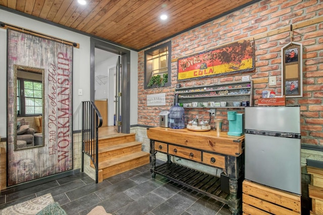 307 N St, Baytown, TX 77520 - interior space featuring stairway, wooden ceiling, recessed lighting, and brick wall