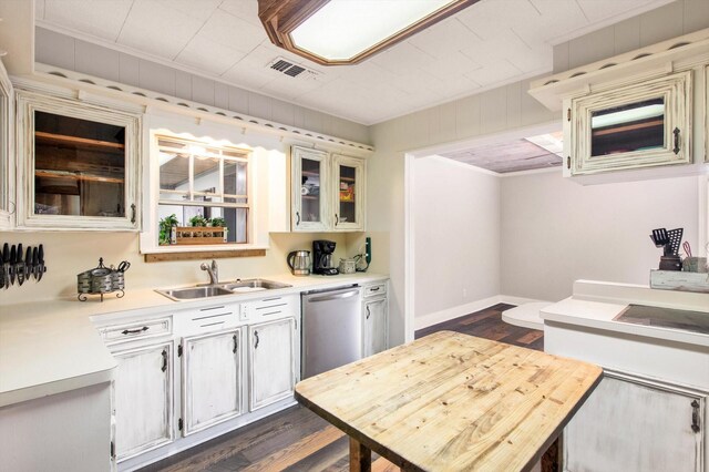 307 N St, Baytown, TX 77520 - kitchen with a sink, dishwasher, light countertops, dark wood-type flooring, and visible vents