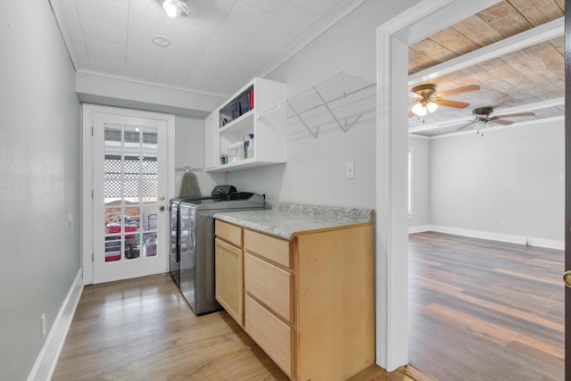 307 N St, Baytown, TX 77520 - kitchen featuring open shelves, ornamental molding, light brown cabinets, light wood-style floors, and independent washer and dryer