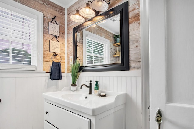 307 N St, Baytown, TX 77520 - bathroom with wooden walls and vanity