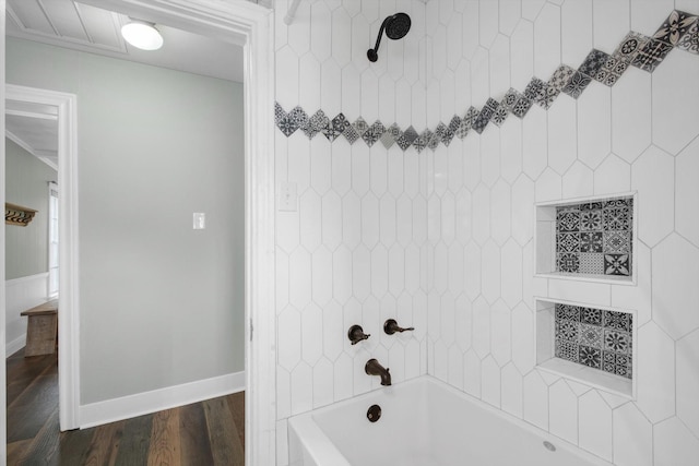 307 N St, Baytown, TX 77520 - full bathroom with baseboards, shower / washtub combination, and wood finished floors