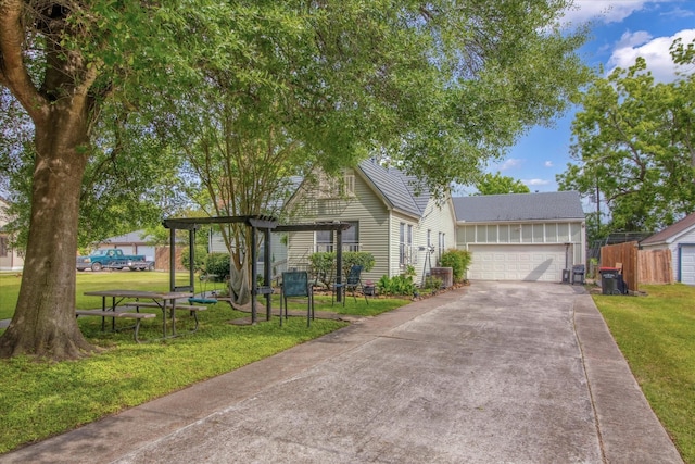 307 N St, Baytown, TX 77520 - single story home with driveway, a front yard, and a garage