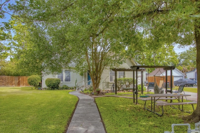 307 N St, Baytown, TX 77520 - surrounding community with fence, a pergola, and a yard