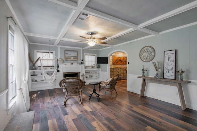 307 N St, Baytown, TX 77520 - dining area featuring a ceiling fan, wood finished floors, beam ceiling, arched walkways, and coffered ceiling