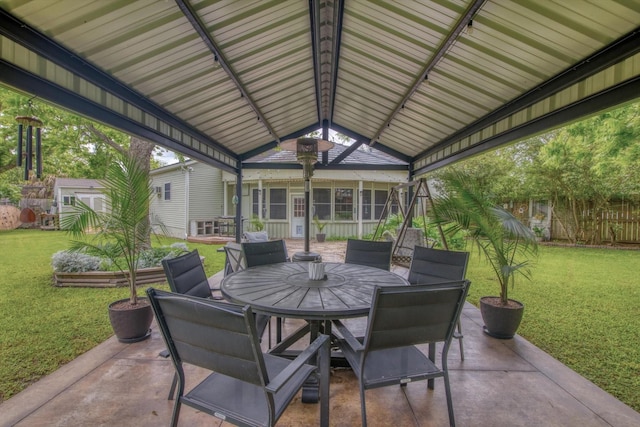 307 N St, Baytown, TX 77520 - view of patio with fence, an outbuilding, and outdoor dining space