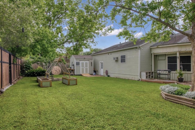307 N St, Baytown, TX 77520 - rear view of property featuring a yard, an outdoor structure, a shed, and a fenced backyard