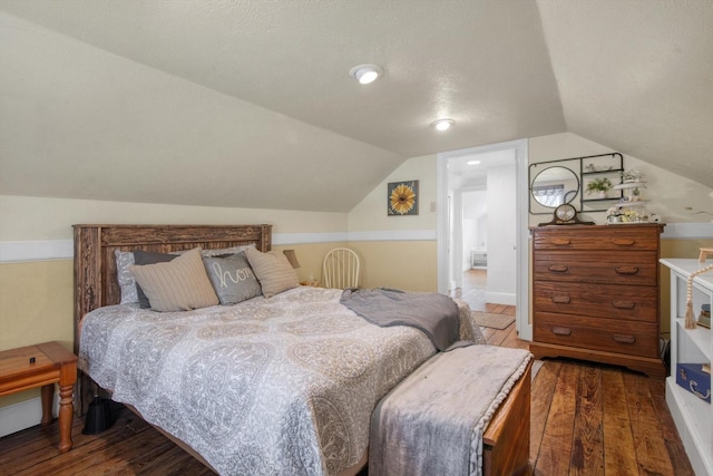 307 N St, Baytown, TX 77520 - bedroom with wood-type flooring and vaulted ceiling