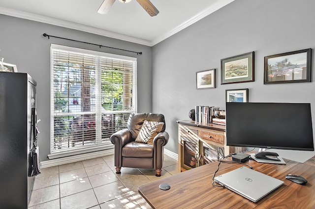 office area with crown molding, ceiling fan, baseboards, and tile patterned flooring