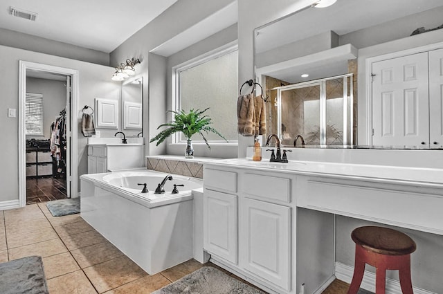 full bath with a garden tub, visible vents, a stall shower, vanity, and tile patterned floors