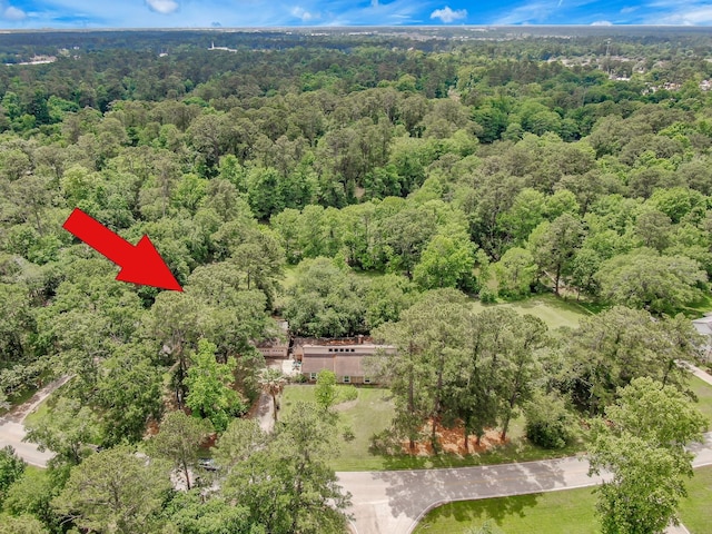 birds eye view of property with a wooded view