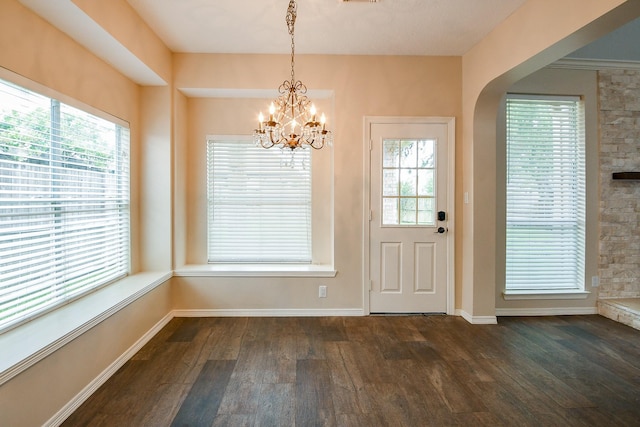 241 Blue Hill Dr, Montgomery, TX 77356 - interior space featuring baseboards, a chandelier, plenty of natural light, and dark wood-type flooring