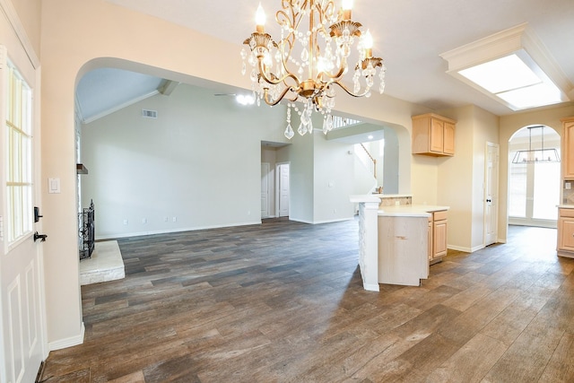 241 Blue Hill Dr, Montgomery, TX 77356 - kitchen featuring visible vents, arched walkways, a chandelier, light brown cabinets, and open floor plan