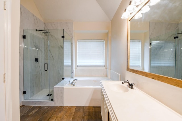 241 Blue Hill Dr, Montgomery, TX 77356 - bathroom with vanity, a shower stall, wood finished floors, lofted ceiling, and a bath