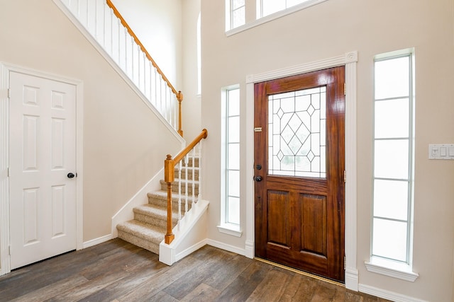 241 Blue Hill Dr, Montgomery, TX 77356 - entryway with baseboards, dark wood finished floors, a high ceiling, and stairway