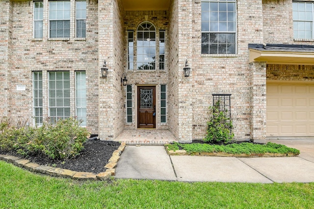 241 Blue Hill Dr, Montgomery, TX 77356 - view of exterior entry with brick siding and a garage