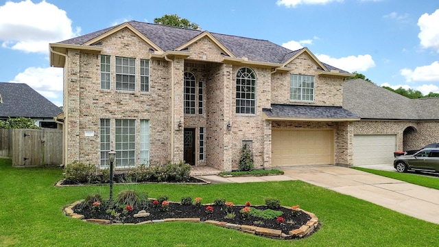 241 Blue Hill Dr, Montgomery, TX 77356 - traditional-style house with a garage, a front lawn, fence, brick siding, and concrete driveway
