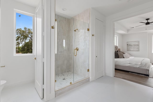 ensuite bathroom with plenty of natural light, ensuite bathroom, and a shower stall