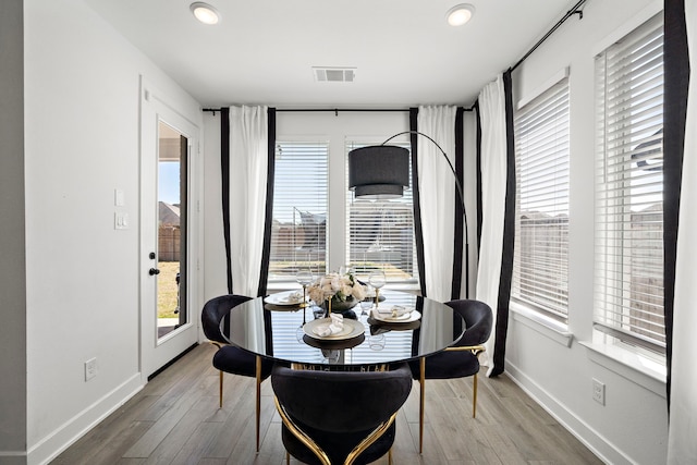 dining area featuring recessed lighting, baseboards, visible vents, and wood finished floors