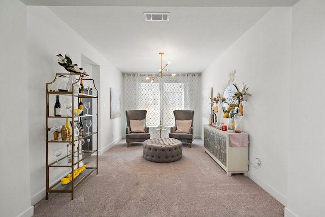 living area with an inviting chandelier, baseboards, carpet floors, and visible vents