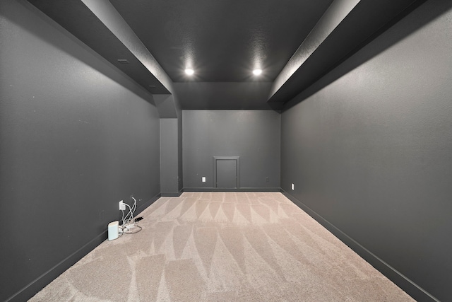 bonus room featuring baseboards and carpet