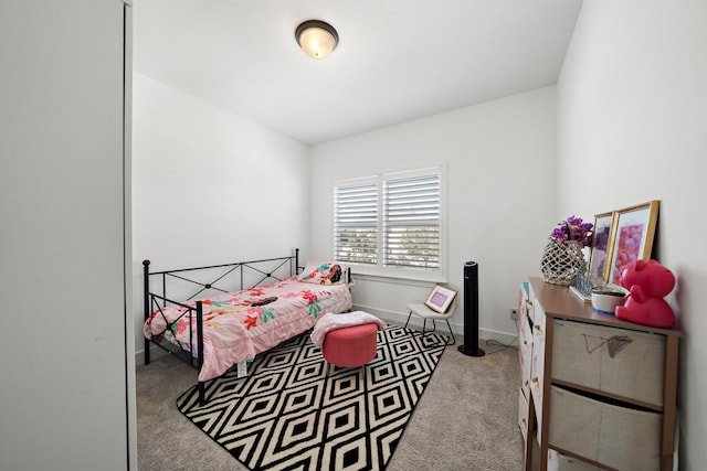 carpeted bedroom with baseboards