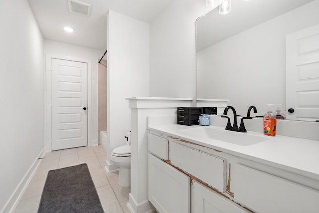 bathroom with tile patterned flooring, vanity, toilet, baseboards, and visible vents