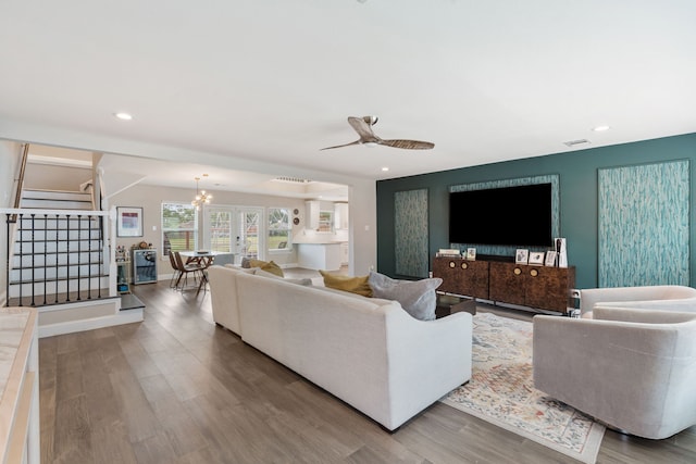 1015 Gardendale Dr, Houston, TX 77018 - living area with recessed lighting, stairs, ceiling fan with notable chandelier, and wood finished floors