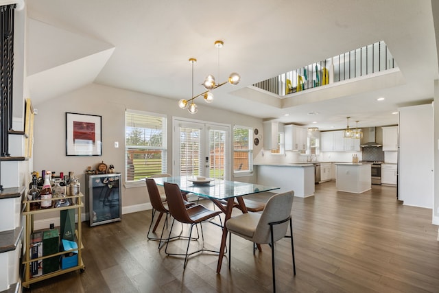 1015 Gardendale Dr, Houston, TX 77018 - dining space with baseboards, dark wood finished floors, beverage cooler, and a chandelier