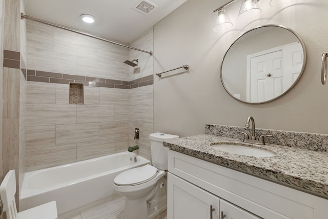 1015 Gardendale Dr, Houston, TX 77018 - full bathroom featuring vanity, toilet, visible vents, and bathtub / shower combination