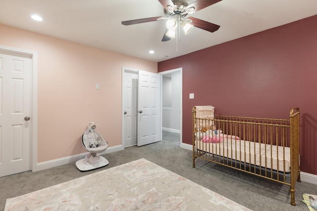 1015 Gardendale Dr, Houston, TX 77018 - carpeted bedroom featuring recessed lighting, baseboards, ceiling fan, and a nursery area