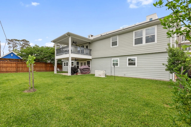 1015 Gardendale Dr, Houston, TX 77018 - rear view of house with fence, a balcony, a ceiling fan, a patio area, and a lawn