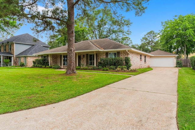 view of front of house with fence, brick siding, a garage, a front yard, and concrete driveway