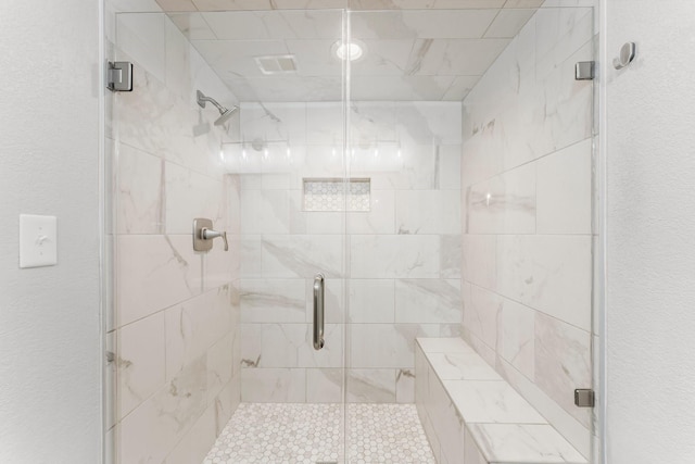 full bath with a shower stall