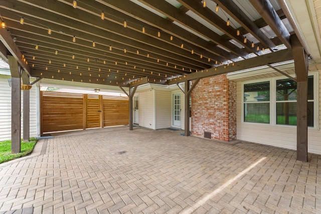view of patio / terrace featuring fence
