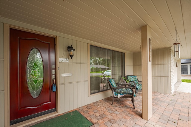 entrance to property featuring a porch