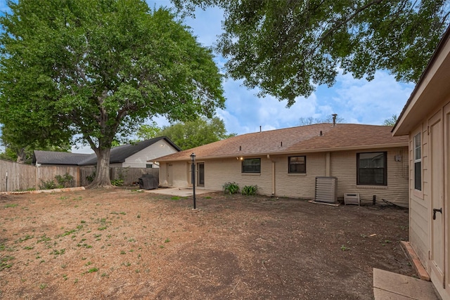 back of property featuring fence