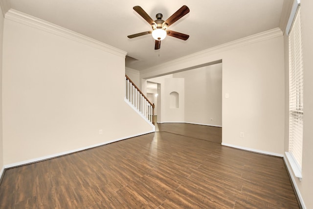 unfurnished living room featuring crown molding, a ceiling fan, and dark wood-style flooring