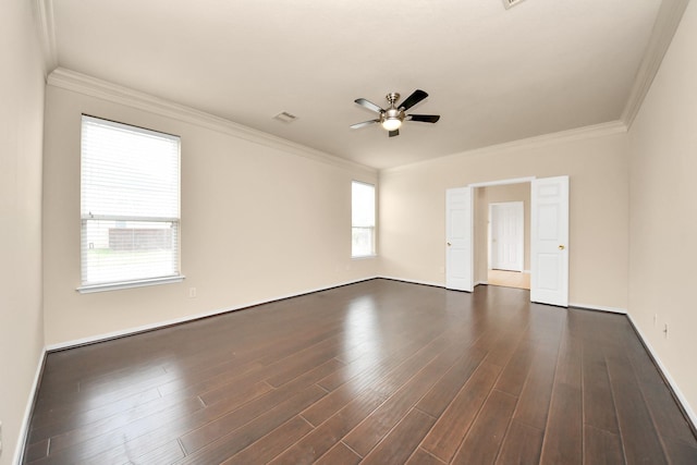 unfurnished room featuring crown molding, dark wood-type flooring, ceiling fan, and visible vents