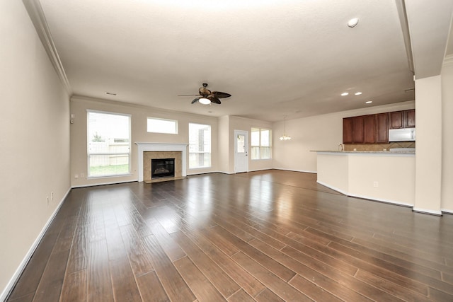 unfurnished living room featuring baseboards, ceiling fan, recessed lighting, and dark wood-type flooring
