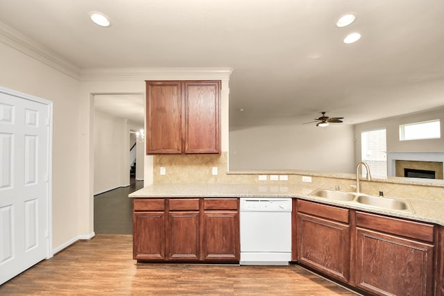 kitchen with ceiling fan, white dishwasher, tasteful backsplash, a sink, and recessed lighting