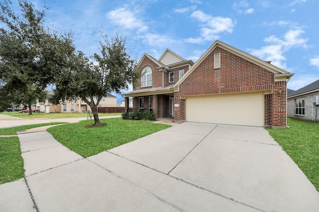 traditional-style home featuring an attached garage, driveway, a front lawn, and brick siding