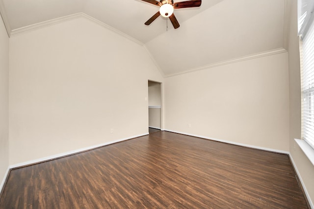 spare room with plenty of natural light, ceiling fan, vaulted ceiling, and dark wood-style floors