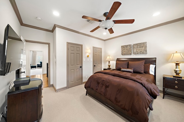 bedroom with light colored carpet, ornamental molding, baseboards, and visible vents