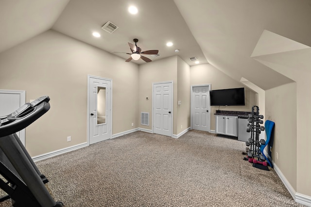 exercise area with visible vents, carpet, a ceiling fan, and lofted ceiling